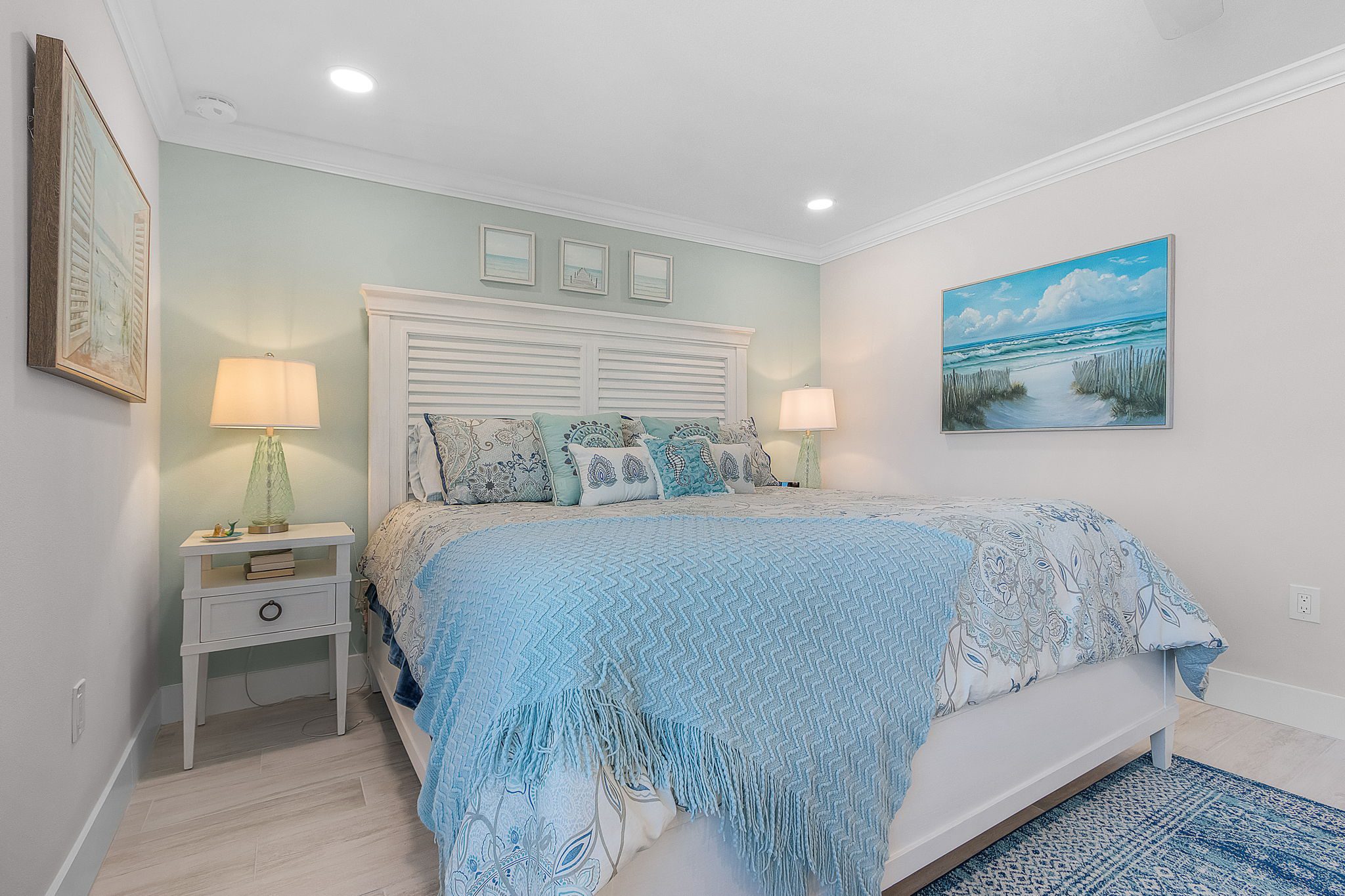 Serene bedroom in Fort Myers Beach luxury condo with coastal design and views of Southwest Florida’s Gulf waters