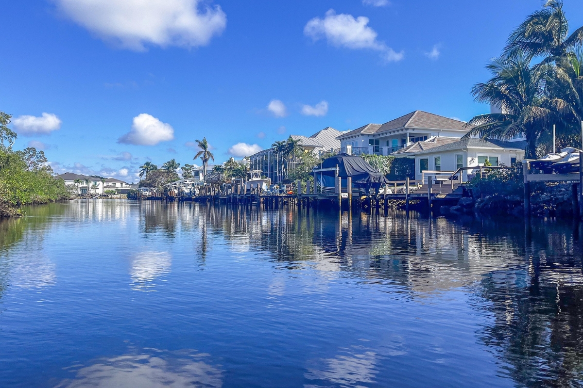 Peaceful Estero canal with beautiful homes and boat lifts—perfect example of Southwest Florida’s serene waterfront neighborhoods